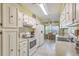 Bright kitchen with white cabinetry and a breakfast nook at 201 Hunt Club Dr, Summerville, SC 29485
