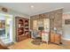 Cozy home office with a brick accent wall and built-in desk at 201 Hunt Club Dr, Summerville, SC 29485