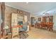 Home office with brick accents, wood floors, and dining room view at 201 Hunt Club Dr, Summerville, SC 29485