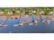 Aerial view of waterfront homes with private docks and boats along the serene waterway at 2037 Shell Ring Cir, Mount Pleasant, SC 29466