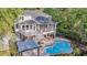 Inviting backyard oasis featuring a pool, covered patio, screened porch, and a relaxing hot tub at 2037 Shell Ring Cir, Mount Pleasant, SC 29466