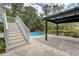 The backyard features a pool, pergola, and stairs leading from a porch, creating an ideal outdoor oasis at 2037 Shell Ring Cir, Mount Pleasant, SC 29466