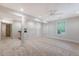 Spacious basement with neutral carpeting, ample lighting, and a convenient wet bar area at 2037 Shell Ring Cir, Mount Pleasant, SC 29466