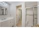 Bathroom with dual sink vanity, mirror, and a glass-enclosed shower for a spa-like experience at 2037 Shell Ring Cir, Mount Pleasant, SC 29466