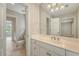Well-lit bathroom featuring a spacious vanity, ample storage, and a large mirror reflecting bright lighting fixtures at 2037 Shell Ring Cir, Mount Pleasant, SC 29466