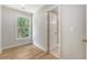 Bright, airy bedroom with hardwood floors, large window, and white trim at 2037 Shell Ring Cir, Mount Pleasant, SC 29466