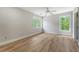 Bedroom with hardwood floors and two windows with scenic wooded views at 2037 Shell Ring Cir, Mount Pleasant, SC 29466