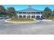 Elegant clubhouse featuring arched entrances, manicured landscaping, and a roundabout for easy access at 2037 Shell Ring Cir, Mount Pleasant, SC 29466