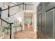 Elegant foyer showcasing a grand staircase, hardwood floors, and an open view to the living area at 2037 Shell Ring Cir, Mount Pleasant, SC 29466
