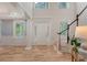 Bright foyer featuring hardwood floors, natural light, and an open staircase at 2037 Shell Ring Cir, Mount Pleasant, SC 29466