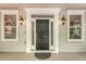 Inviting front entrance with a dark door flanked by sidelights and decorative lighting fixtures at 2037 Shell Ring Cir, Mount Pleasant, SC 29466