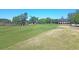 Picturesque view of a golf course with lush green fairways with the clubhouse in the background at 2037 Shell Ring Cir, Mount Pleasant, SC 29466