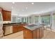 Bright and open kitchen with wood cabinets, stainless steel appliances, hardwood floors, and a sunlit breakfast nook at 2037 Shell Ring Cir, Mount Pleasant, SC 29466