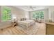 Bright main bedroom featuring hardwood floors, natural light, and sitting area at 2037 Shell Ring Cir, Mount Pleasant, SC 29466