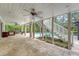 Spacious covered patio with travertine flooring, ceiling fans, bar area, and stairs to the pool at 2037 Shell Ring Cir, Mount Pleasant, SC 29466