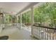 Spacious covered porch with classic columns, white railings, and scenic views of the surrounding greenery at 2037 Shell Ring Cir, Mount Pleasant, SC 29466