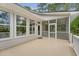 Sunroom with large windows and access to the outdoor balcony, ideal for enjoying the view at 2037 Shell Ring Cir, Mount Pleasant, SC 29466