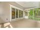 Well-lit porch featuring sliding glass doors and a wood-paneled ceiling, offering a seamless blend of indoor-outdoor living at 2037 Shell Ring Cir, Mount Pleasant, SC 29466