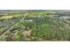 Scenic aerial shot of a wooded acreage featuring a road and residences, perfect for development at 2080 Sniders Hwy, Walterboro, SC 29488