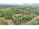 Beautiful aerial view of a vast wooded property with a home, surrounded by lush green trees and natural landscape at 2080 Sniders Hwy, Walterboro, SC 29488