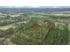 Aerial view highlighting property's location amidst surrounding mature trees and easy access to town at 2080 Sniders Hwy, Walterboro, SC 29488