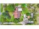 Aerial view of a home with a mature trees and multiple outbuildings on a large lot at 2080 Sniders Hwy, Walterboro, SC 29488