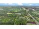 Overhead view showcasing a property surrounded by dense trees, near a road, and in proximity to a town at 2080 Sniders Hwy, Walterboro, SC 29488