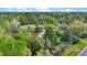 Aerial shot of a wooded property featuring a home and multiple outbuildings at 2080 Sniders Hwy, Walterboro, SC 29488