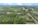 Overhead view showcasing a property surrounded by dense trees, near a road, and in proximity to a town at 2080 Sniders Hwy, Walterboro, SC 29488