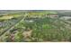 Scenic aerial shot of a wooded acreage featuring a road and residences, perfect for development at 2080 Sniders Hwy, Walterboro, SC 29488