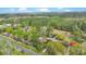 Aerial view highlighting the property, its mature trees, surrounding greenery, and roadway access at 2080 Sniders Hwy, Walterboro, SC 29488