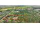 Aerial view of land parcel, marked by a red line, amidst dense trees and scenic greenery at 2080 Sniders Hwy, Walterboro, SC 29488