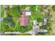 Aerial view of a home with a mature trees and multiple outbuildings on a large lot at 2080 Sniders Hwy, Walterboro, SC 29488