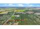 Expansive aerial view of a home and land, surrounded by lush greenery and bordered by a red outline at 2080 Sniders Hwy, Walterboro, SC 29488