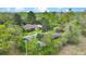 Aerial view of a home with mature trees and multiple outbuildings on a large lot at 2080 Sniders Hwy, Walterboro, SC 29488