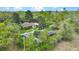 Aerial view of a home with mature trees and multiple outbuildings on a large lot at 2080 Sniders Hwy, Walterboro, SC 29488