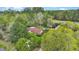 Aerial view of a home and outbuildings surrounded by mature trees and a vast, forested property at 2080 Sniders Hwy, Walterboro, SC 29488