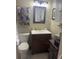 Cozy bathroom featuring a vanity with a dark wood cabinet and white countertop and neutral wall color at 210 Ellen St, Goose Creek, SC 29445