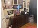 Bedroom has a dark dresser and sports memorabilia wall decor at 210 Ellen St, Goose Creek, SC 29445
