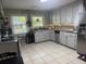 Clean and functional kitchen with white cabinets, stainless steel appliances, and ample counter space for meal preparation at 210 Ellen St, Goose Creek, SC 29445