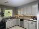 Charming kitchen with granite countertops, stainless steel appliances, and custom backsplash at 210 Ellen St, Goose Creek, SC 29445