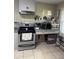 Functional kitchen area with modern appliances, neutral countertops, and easy-to-clean floors, perfect for cooking enthusiasts at 210 Ellen St, Goose Creek, SC 29445