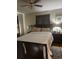 A well lit main bedroom featuring a fan and large comfortable bed at 210 Ellen St, Goose Creek, SC 29445