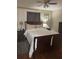Nicely furnished main bedroom with warm lighting, wooden floors and bedside tables at 210 Ellen St, Goose Creek, SC 29445