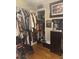 Walk-in closet with dark wood dresser, mirror, and clothes racks at 210 Ellen St, Goose Creek, SC 29445
