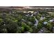 Tranquil aerial view of a charming neighborhood nestled amongst lush greenery and a winding road at 2104 Royal Pine Dr, Seabrook Island, SC 29455