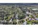 Expansive aerial view of a luxury home surrounded by lush greenery and mature trees in a serene neighborhood at 2104 Royal Pine Dr, Seabrook Island, SC 29455