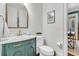 A bathroom with a turquoise cabinet and white tile at 2104 Royal Pine Dr, Seabrook Island, SC 29455