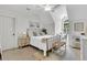 Bedroom features a black metal bed frame, white linens, and a window seat for additional seating at 2104 Royal Pine Dr, Seabrook Island, SC 29455