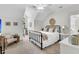 Bright bedroom with a black metal bed frame, neutral decor, and a window with natural light at 2104 Royal Pine Dr, Seabrook Island, SC 29455